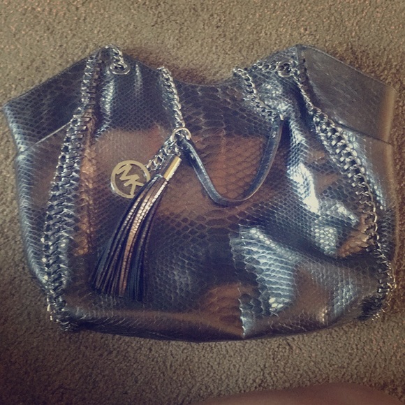 Michael Kors Handbags - Michael Kors purse silver like new